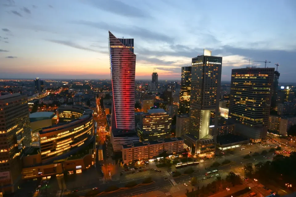 Warsaw skyline at sunset with modern city buildings viewed from above