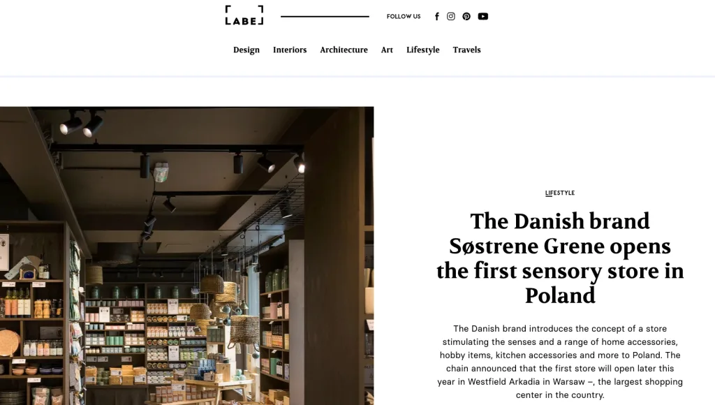Article about the first Søstrene Grene sensory store in Poland, featuring a warmly lit retail interior
