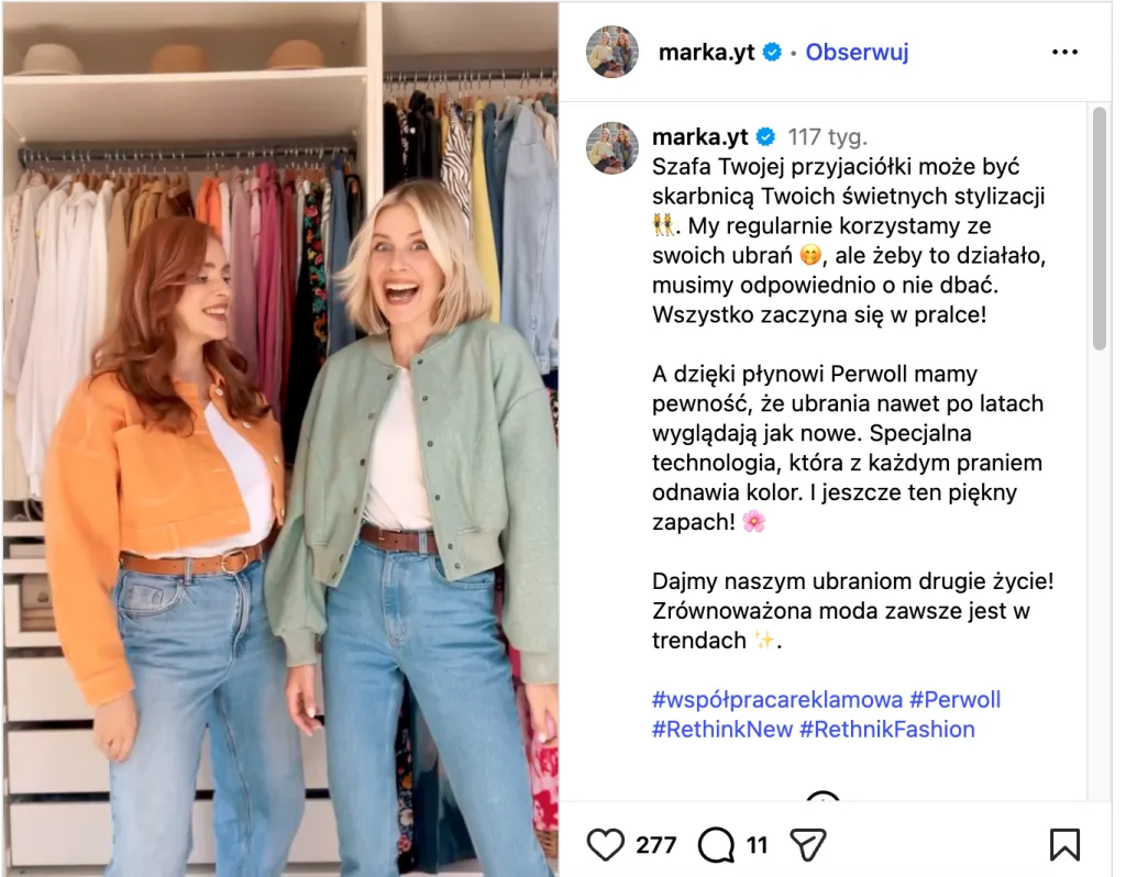 Two women standing in front of an open wardrobe filled with colorful clothes, smiling while choosing outfits.