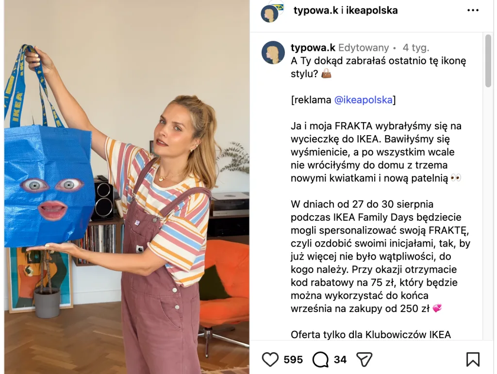 Young woman holding a blue IKEA shopping bag while standing in a modern living room.
